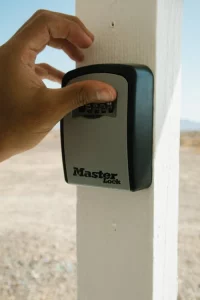 Image of a key safe secured to a wooden post