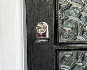 Image of yale rim cylinder on a wooden door