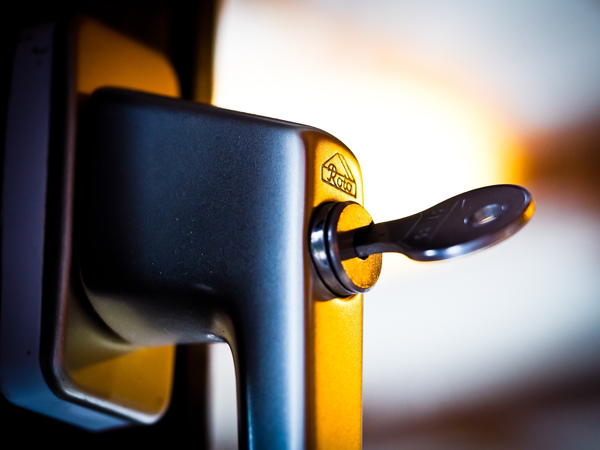 Close up image of a internal window handle and key